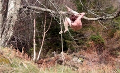 Naked self-bondage in the woods gone wrong.