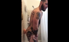 Tatted Hunk Fucks Dildo in Shower Until He Cums