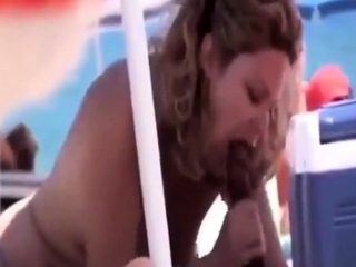 mature sucks black cock on beach