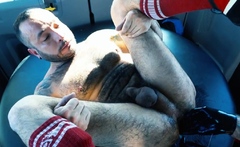 Tattooed hunk in gloves fisting stud ass