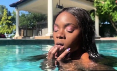 Naked ebony MILF fingers her hairy pussy