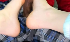 Brunette with foot fetish rubs big dick with her feet in POV
